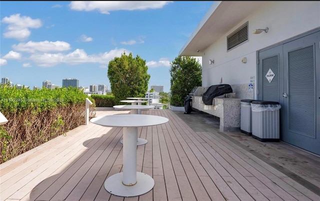 wooden deck featuring area for grilling