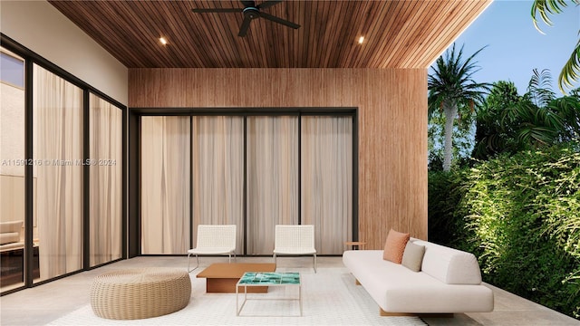 view of patio with ceiling fan and an outdoor living space