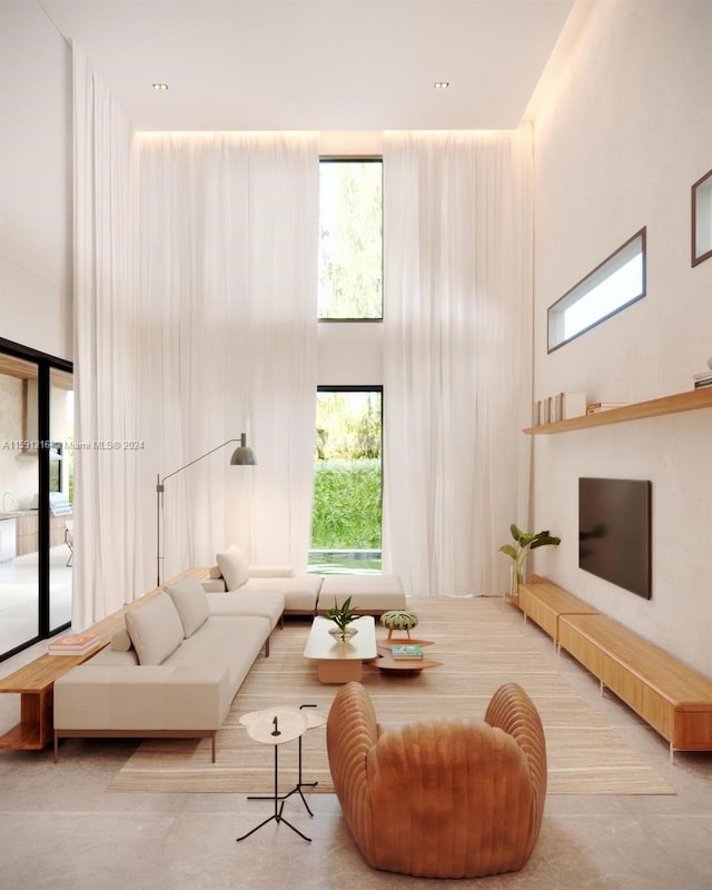 living room with a towering ceiling