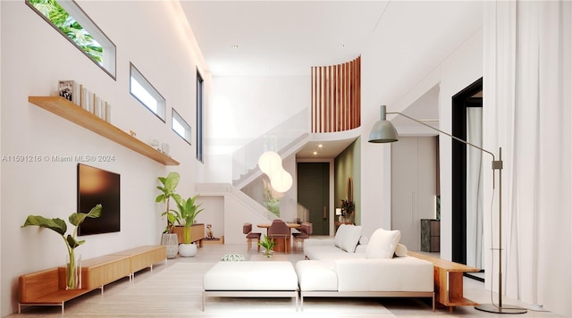 living room featuring a towering ceiling