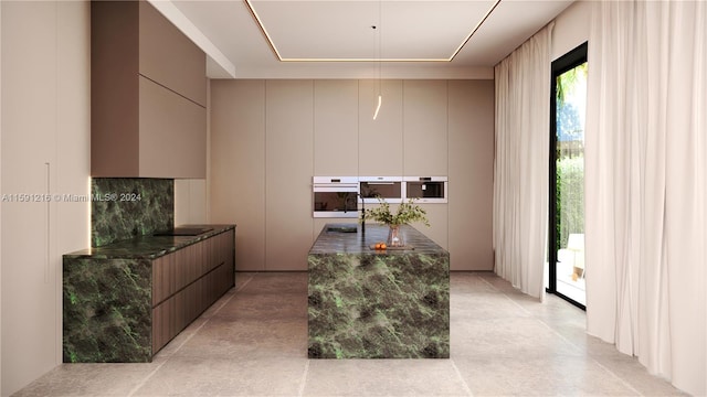 interior space featuring white oven, dark stone counters, and backsplash