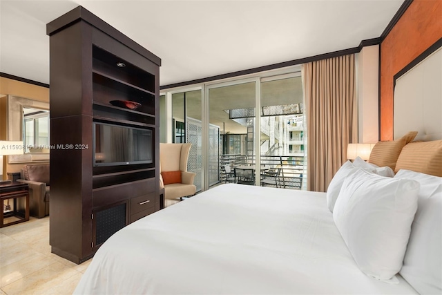 bedroom featuring access to exterior, crown molding, and light tile floors