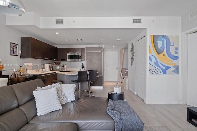 living room featuring light wood-type flooring