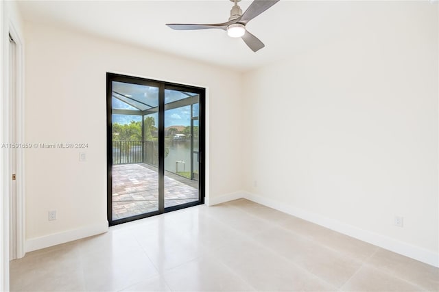 unfurnished room with light tile patterned flooring and ceiling fan