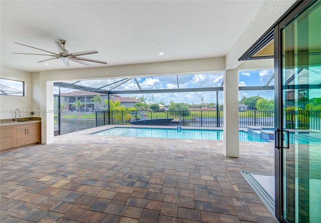 view of pool with sink and ceiling fan