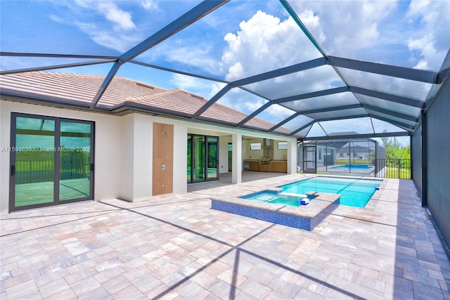 view of swimming pool featuring an in ground hot tub, area for grilling, glass enclosure, and a patio