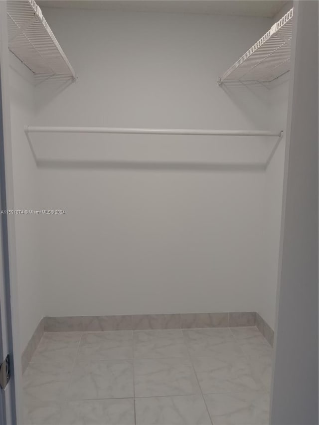 5387 SW 40th Ave Unit 105, Dania Beach, FL 33314 - walk in closet featuring marble finish floors