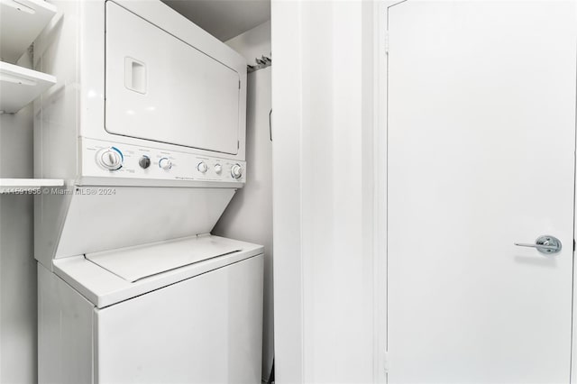 laundry room featuring stacked washing maching and dryer