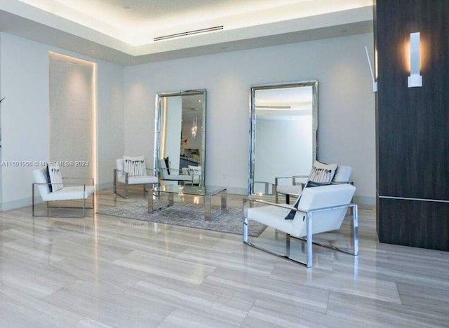 sitting room featuring light tile floors