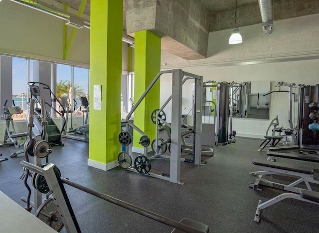 exercise room featuring a high ceiling