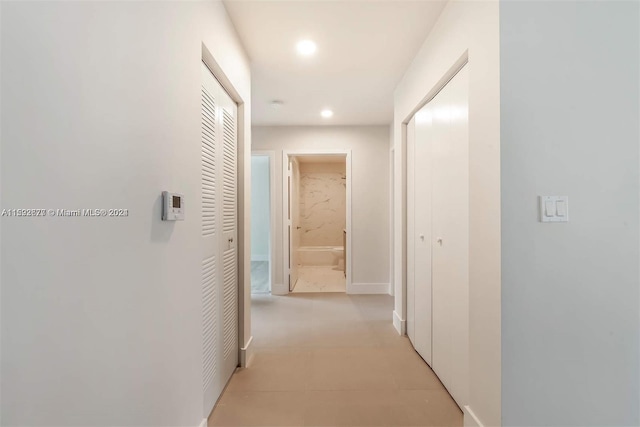 hallway with light tile flooring