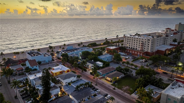 aerial view at dusk with a water view