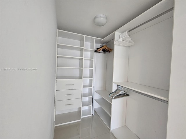 walk in closet featuring tile patterned floors