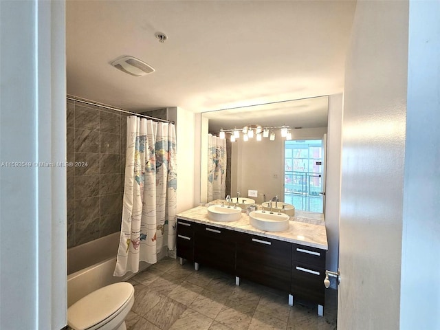 full bathroom featuring dual vanity, tile patterned flooring, toilet, and shower / bath combo