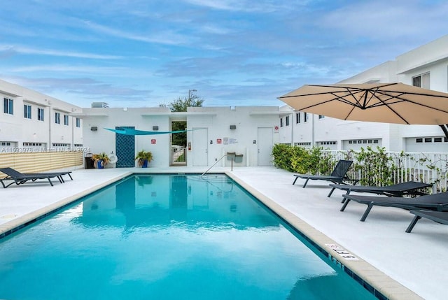 view of pool featuring a patio