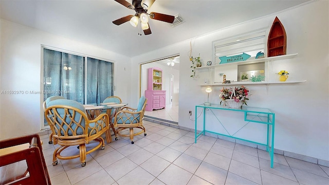 dining area featuring ceiling fan and light tile patterned floors