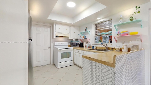 kitchen featuring a raised ceiling, custom range hood, white cabinets, sink, and white range with electric cooktop