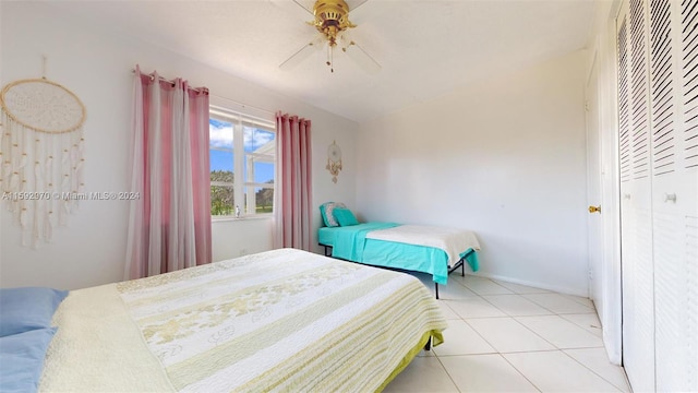 bedroom featuring ceiling fan and light tile patterned floors