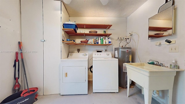 laundry area featuring a textured ceiling, washer and clothes dryer, water heater, and sink