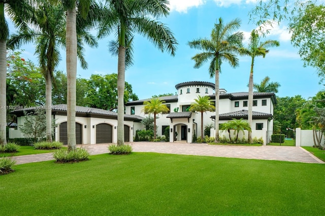 view of front of house featuring a front yard and a garage