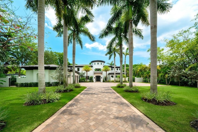 view of home's community with a lawn