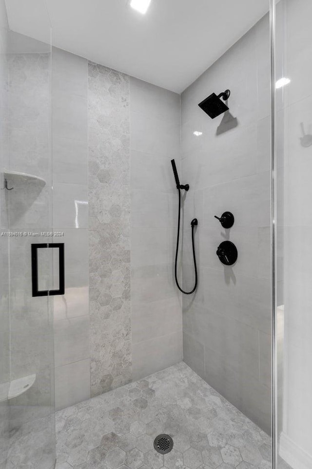 bathroom with tiled shower