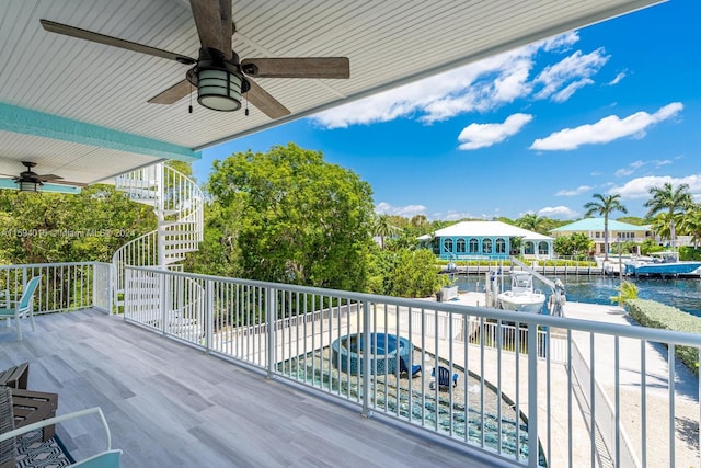 exterior space featuring a water view and ceiling fan