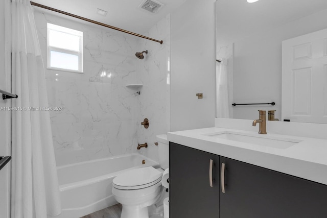 full bathroom with shower / tub combo, hardwood / wood-style floors, toilet, and vanity with extensive cabinet space