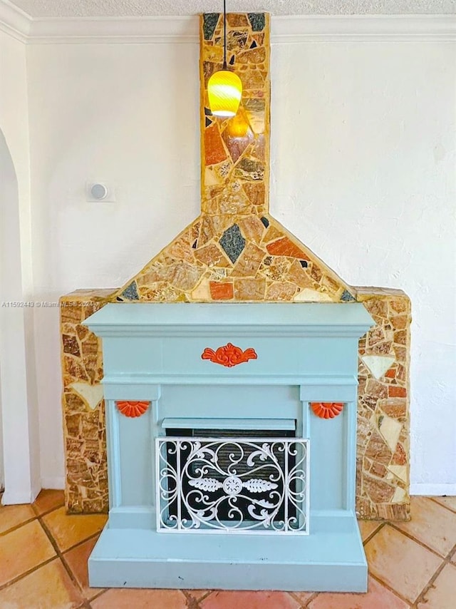 details featuring ornamental molding and tile floors