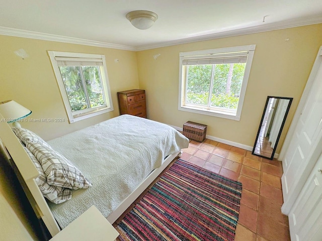 bedroom featuring ornamental molding and tile floors