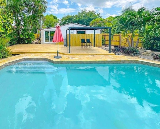 view of pool featuring a wooden deck