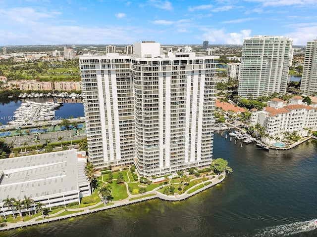 birds eye view of property with a water view