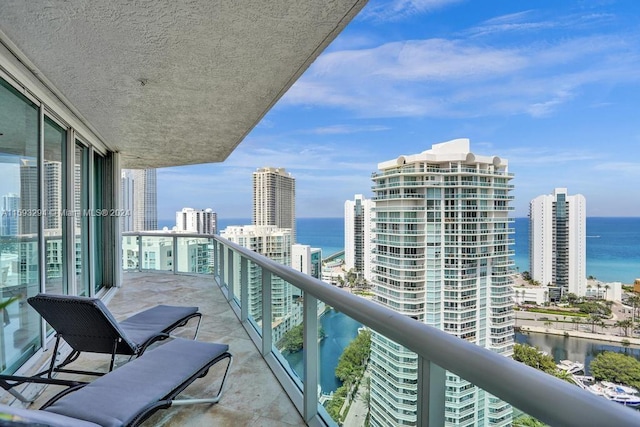 balcony featuring a water view