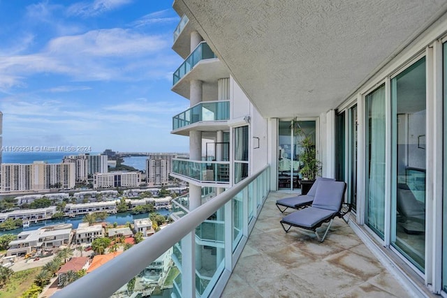 balcony featuring a water view