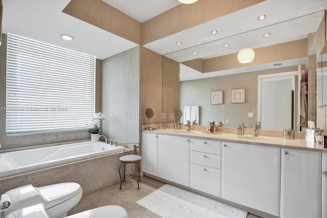 bathroom with a relaxing tiled tub, toilet, tile patterned floors, vanity, and a bidet