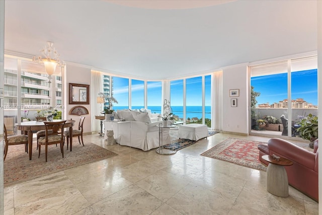 living room featuring tile floors, floor to ceiling windows, and a water view