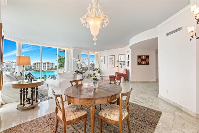 tiled dining space with a wall of windows and an inviting chandelier