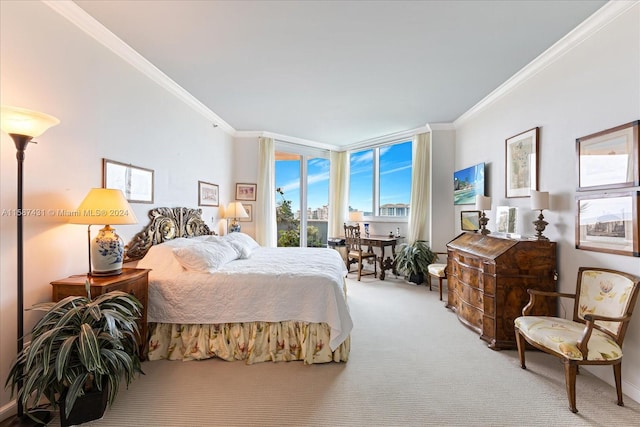 bedroom with crown molding, carpet, and expansive windows