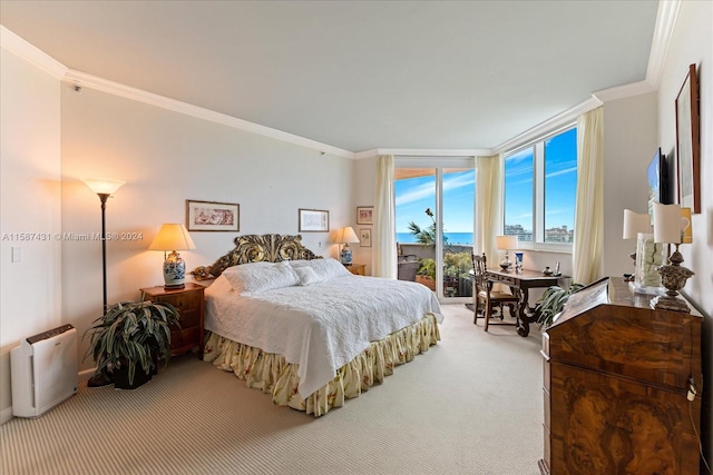 bedroom featuring ornamental molding, carpet flooring, and access to outside