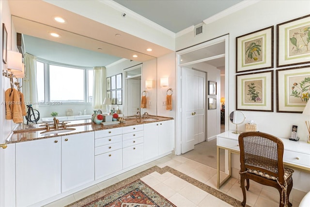 bathroom featuring tile floors, ornamental molding, and double sink vanity