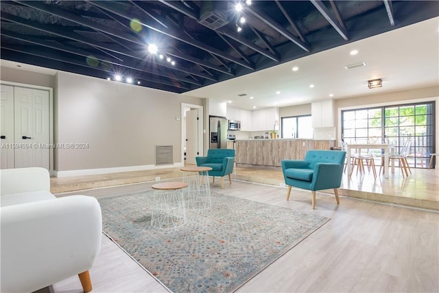 living room with light hardwood / wood-style floors