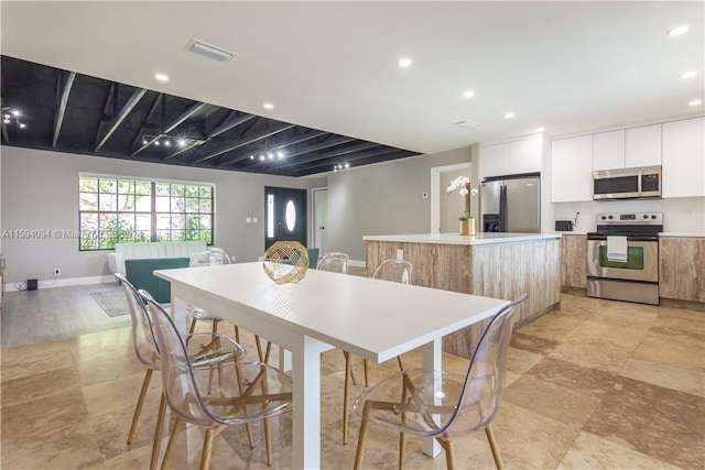 dining room with light tile floors