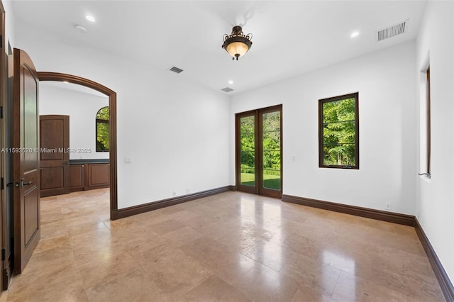 spare room with french doors