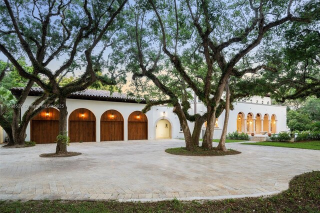 mediterranean / spanish-style house featuring a garage