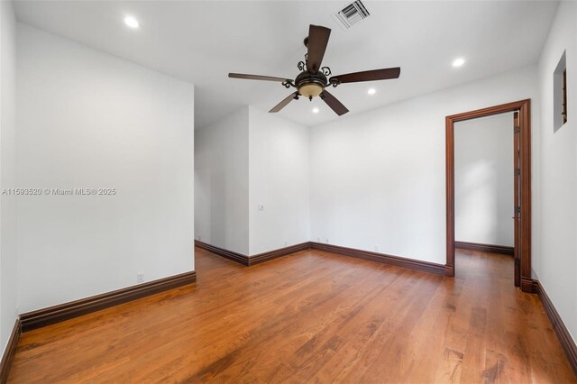 unfurnished room with wood-type flooring and ceiling fan