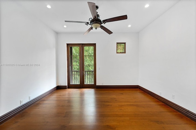 spare room featuring ceiling fan, french doors, and hardwood / wood-style floors