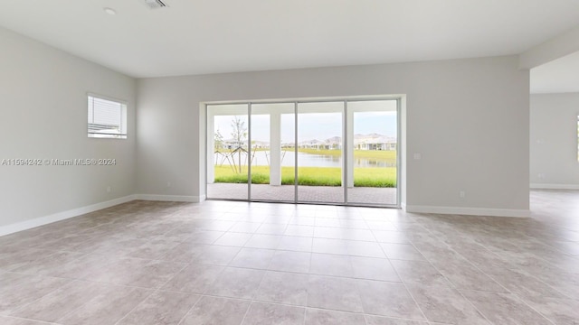 spare room with light tile flooring