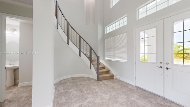 tiled entrance foyer with french doors