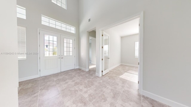 tiled foyer entrance with french doors