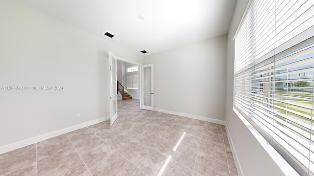 view of tiled spare room